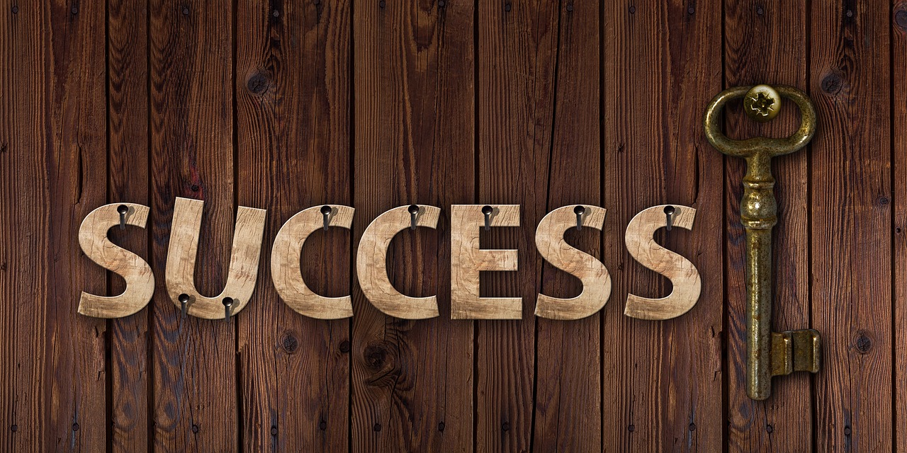 Picture of the words success with a key